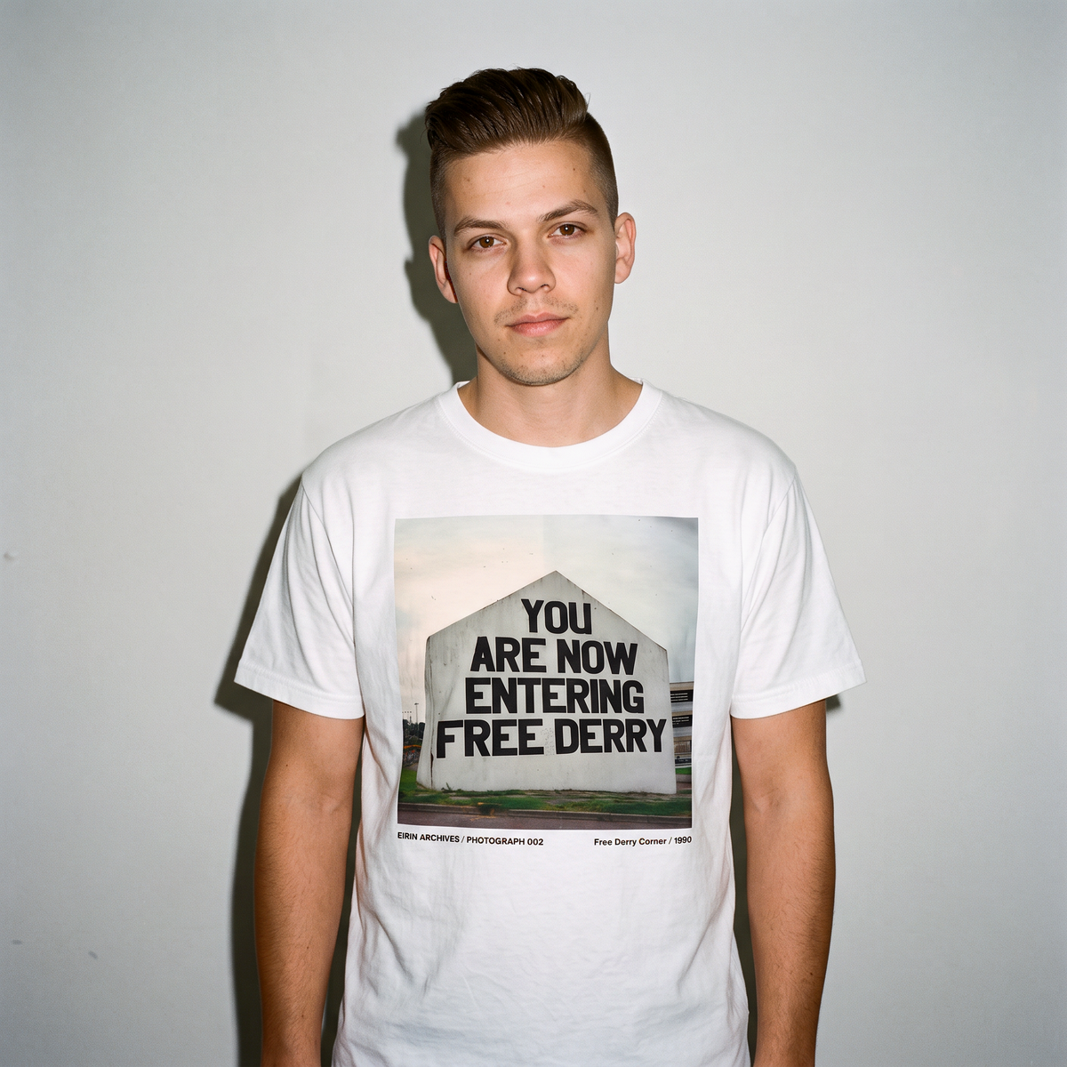 Eirin Apparel Unisex T-Shirt EIRIN ARCHIVES / PHOTOGRAPH 002 – Free Derry Corner 1990
